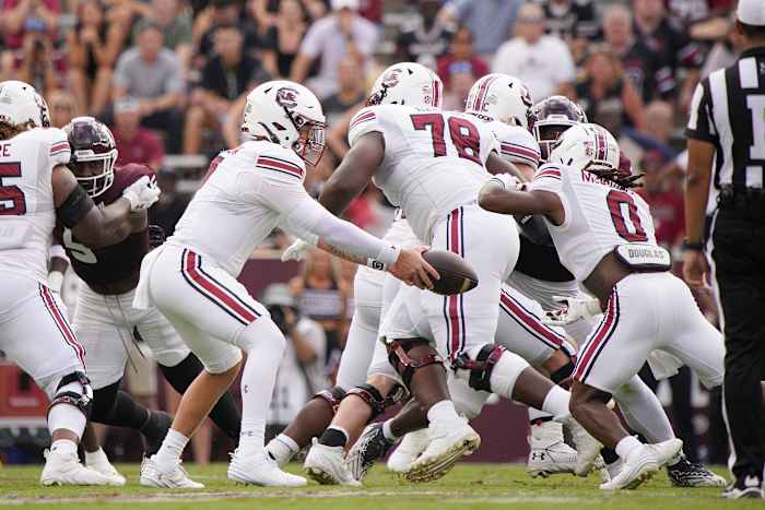 Trovon Baugh pulling to create a run lane for junior running back Juju McDowell (28th Oct., 2023)